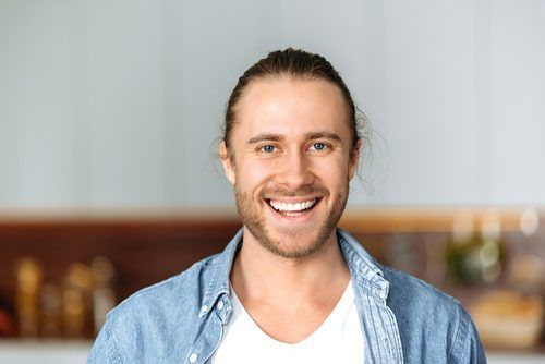 Stylish young man in denim shirt