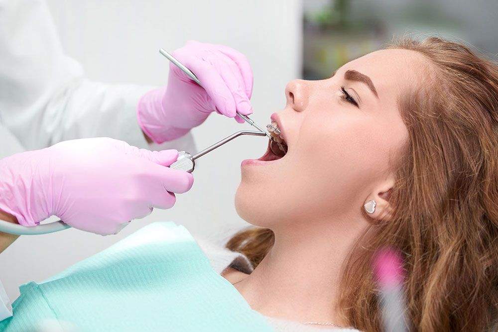 young woman getting dental examination