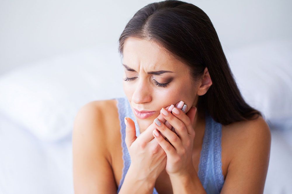 Woman suffering from toothache