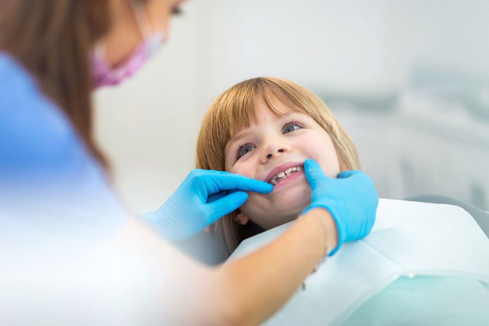 Female dentist and child in a dentist office