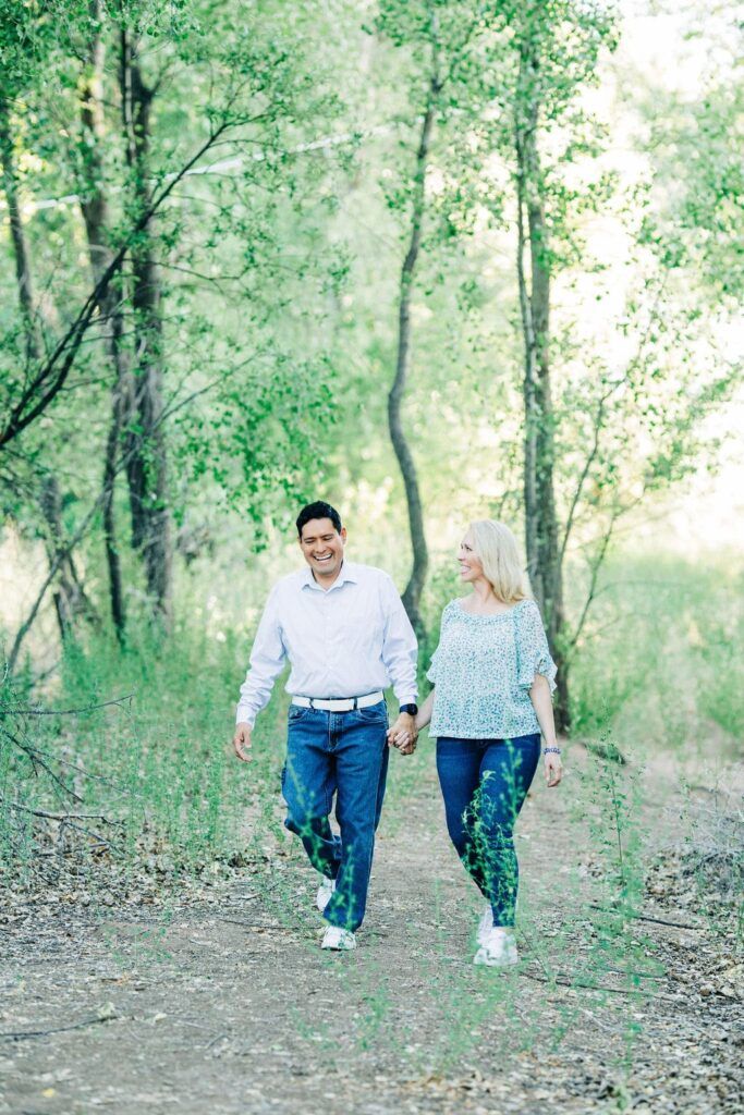 Tammy Frost walking with a man on a wooded trail in a peaceful outdoor setting