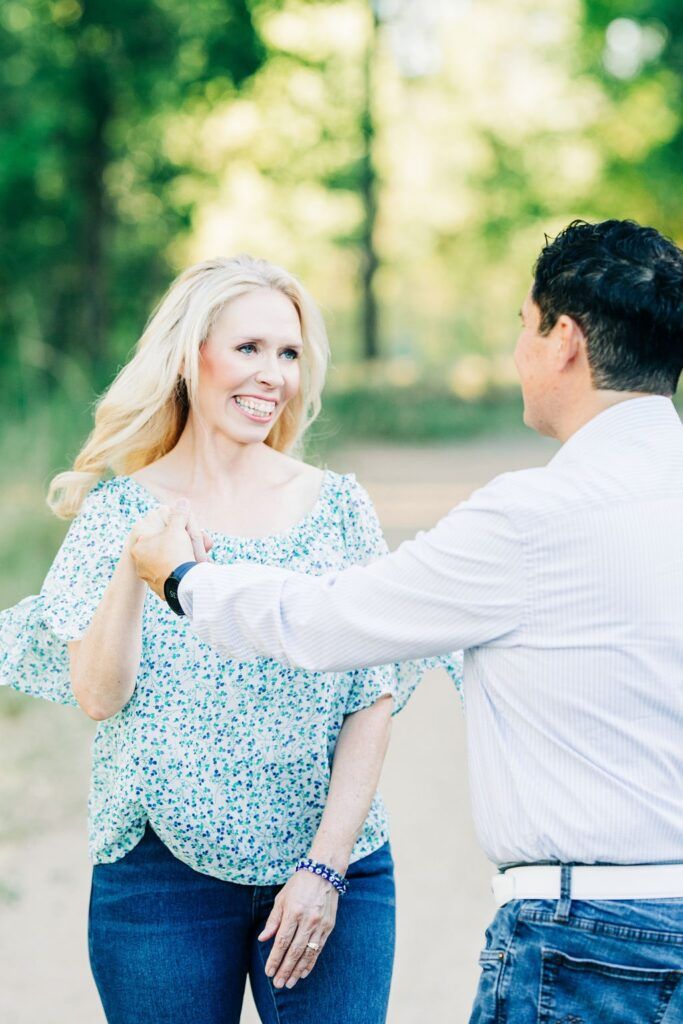 Tammy Frost talking with a man outdoors in a friendly conversation