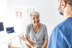 primary care doctor explaining to patient the alternative osteoporosis treatments