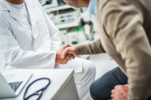 Patient shaking hands with doctor during direct primary care visit in Prescott clinic