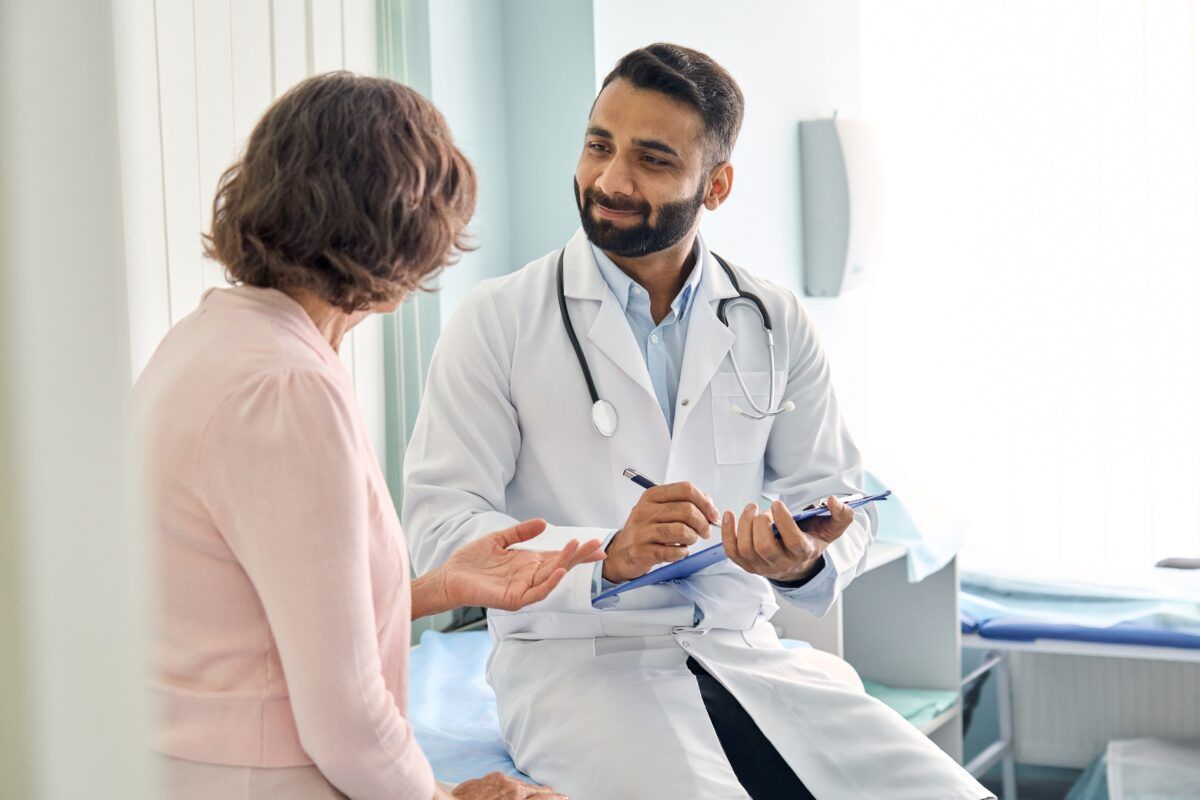 male doctor consulting senior old patient