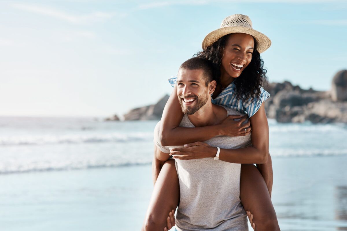 happy couple enjoying at beach