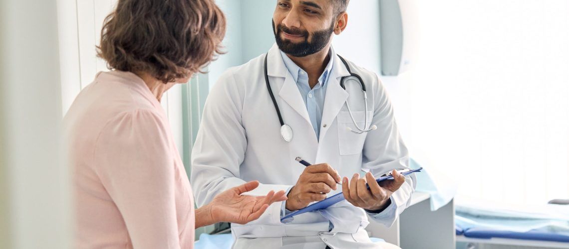 male doctor consulting senior old patient