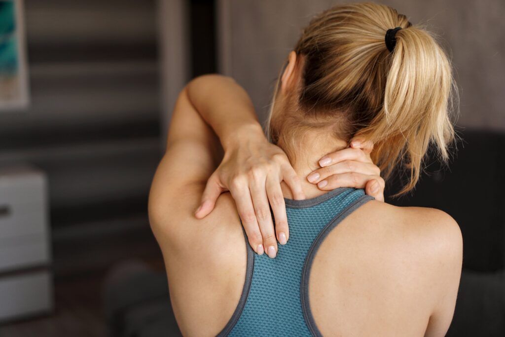 girl feeling pain in her neck