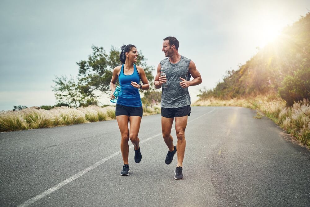 Couple, road and happy with running for fitness