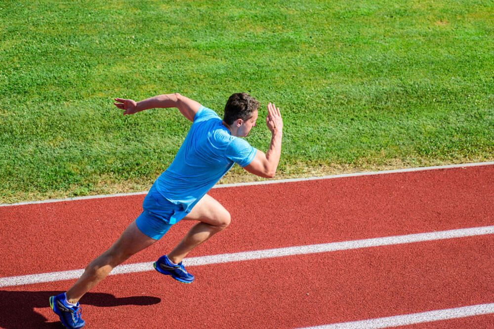 Runner in motion. Man athlete run training.