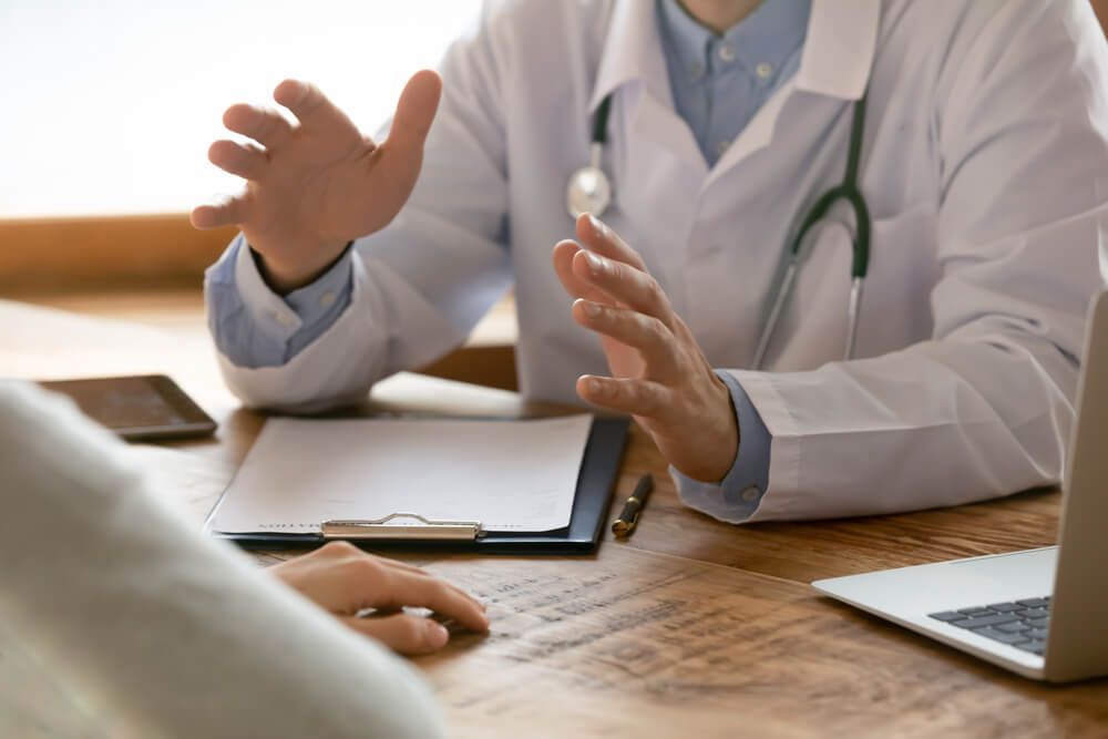 male doctor in white medical uniform consult patient