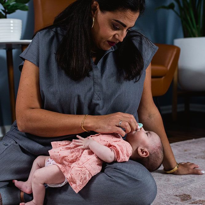 Team member with an infant - Milk & Milestones Therapy