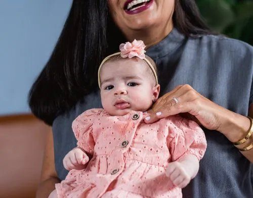 Team member with an infant - Milk & Milestones Therapy