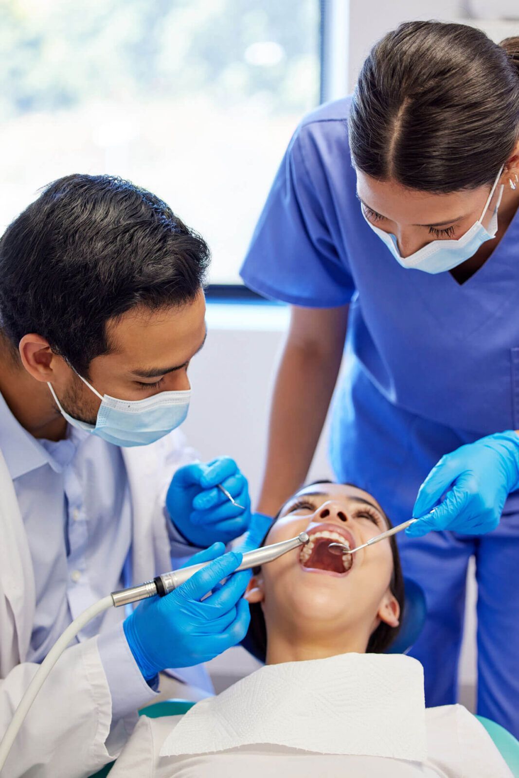 Dentist, oral care and procedure with patient