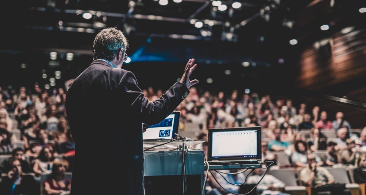 Public speaker giving talk at Event