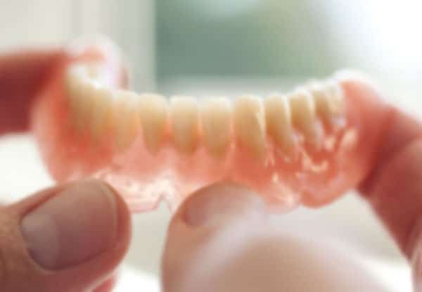 Dental technician working in dental laboratory