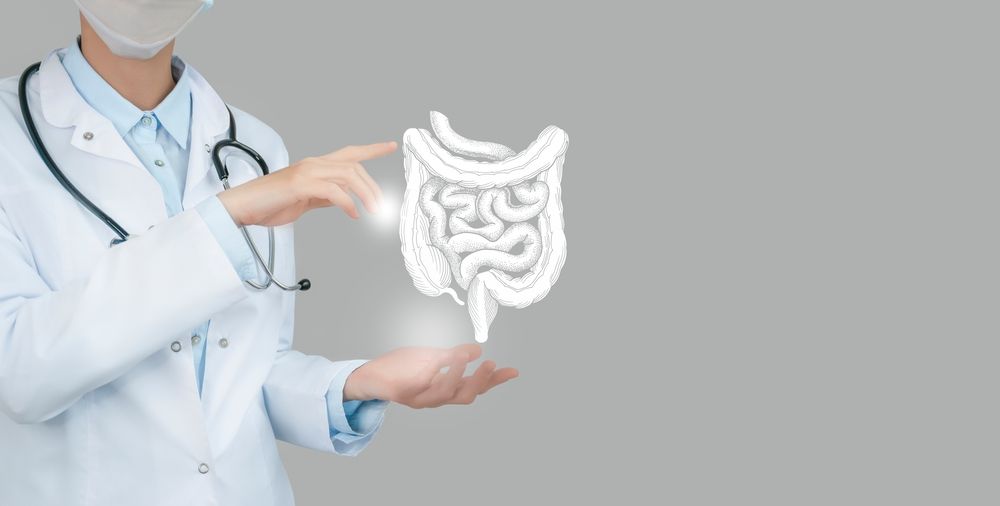 Female Doctor Holding Virtual Intestine