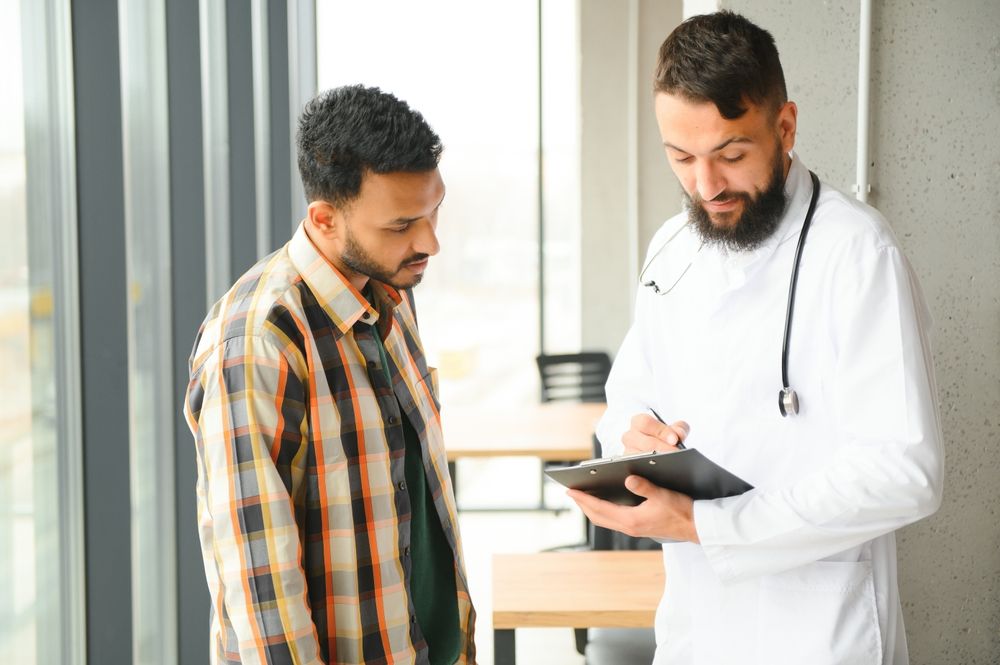 Man Is Being Examined By A Doctor