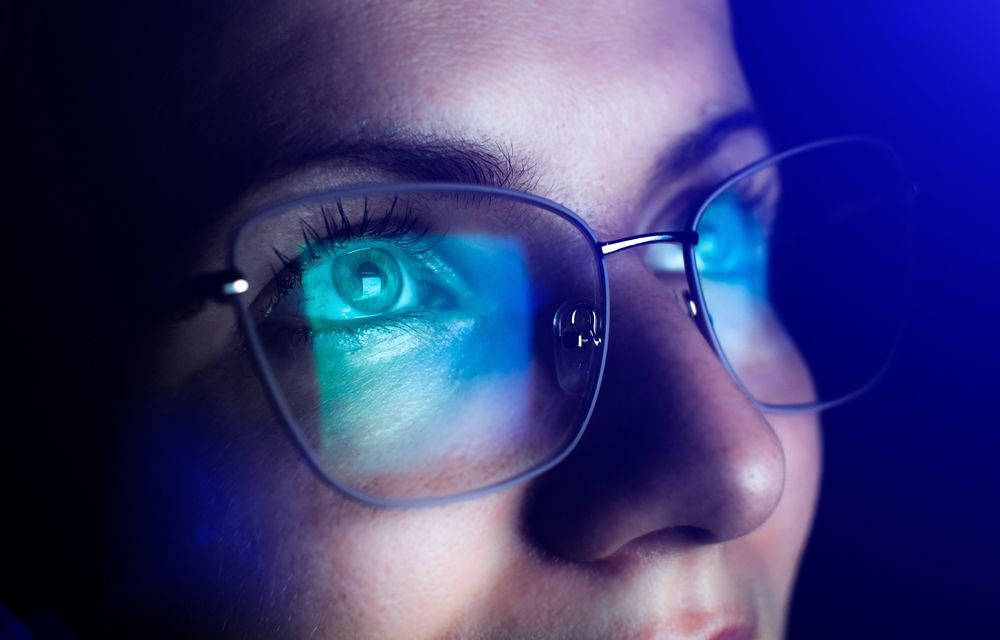 Girl,Works,On,Internet.,Reflection,At,The,Glasses,From,Laptop.