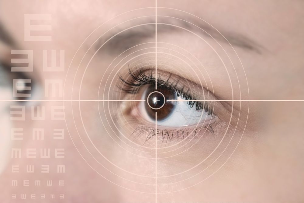 eye laser surgery concept, close up of female amber eye with digital augmentation, teen or kid eyes