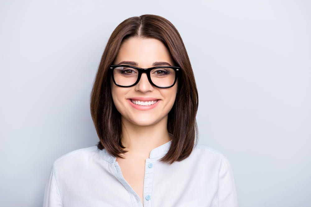 Portrait of trendy, caucasian, cheerful, modern, nice, stylish, cute, clever girl in eyewear