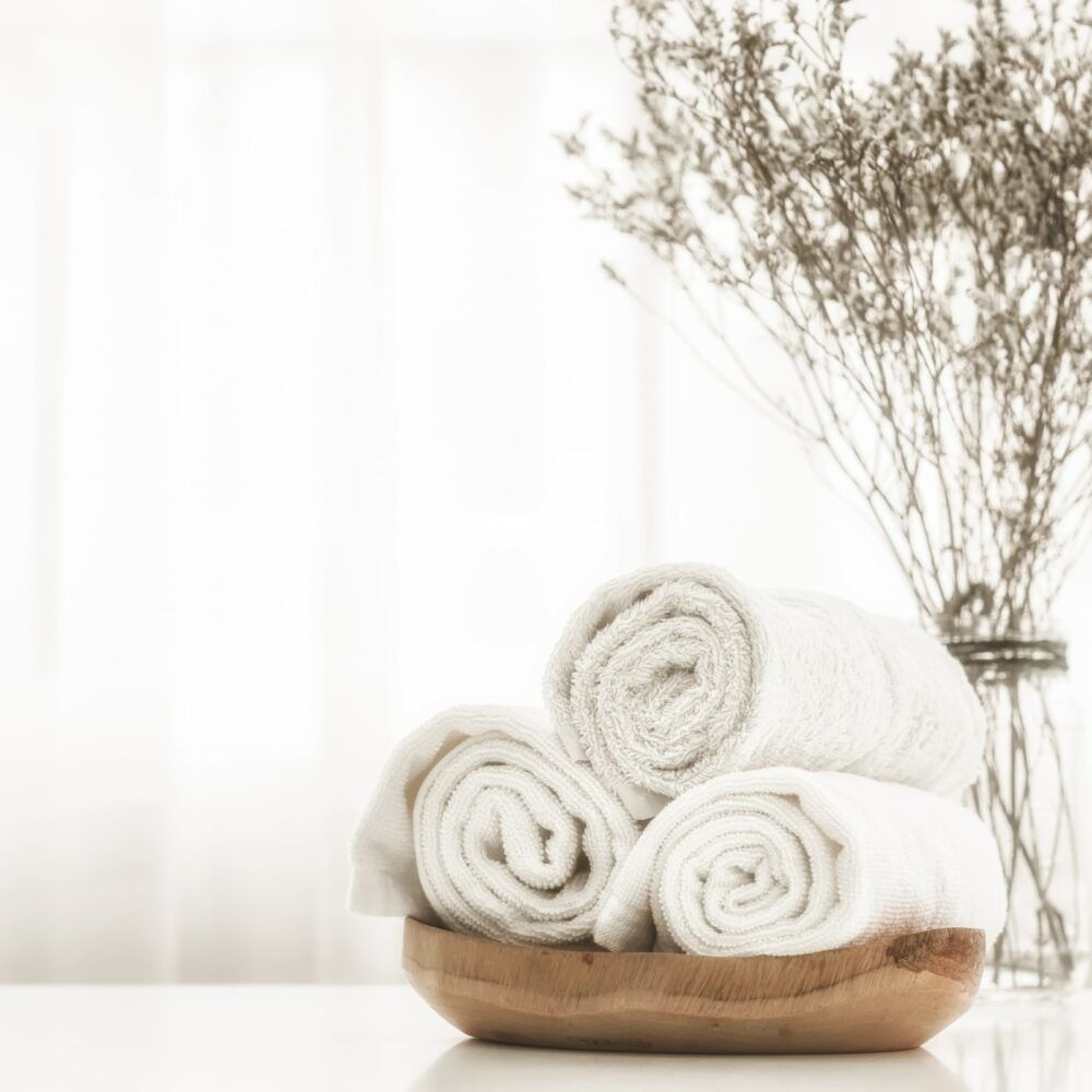 Towels on wood plate