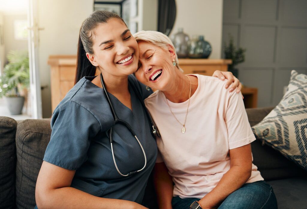 Senior woman hug medical caregiver