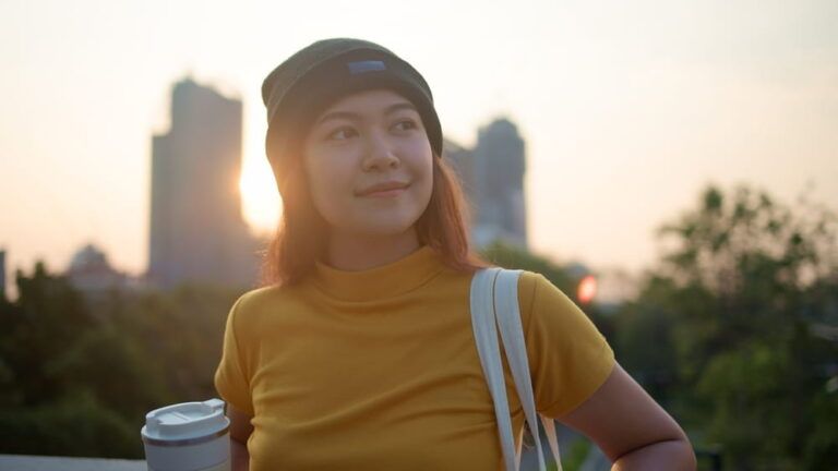 Go green Gen Z woman asia young people looking away in city life nature tree public park