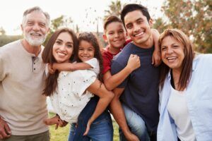 Three generation family standing in the park