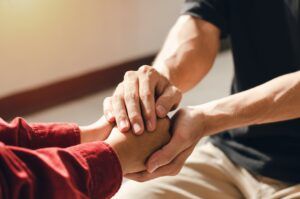 Couples holding hands together to give good encouragement to each other