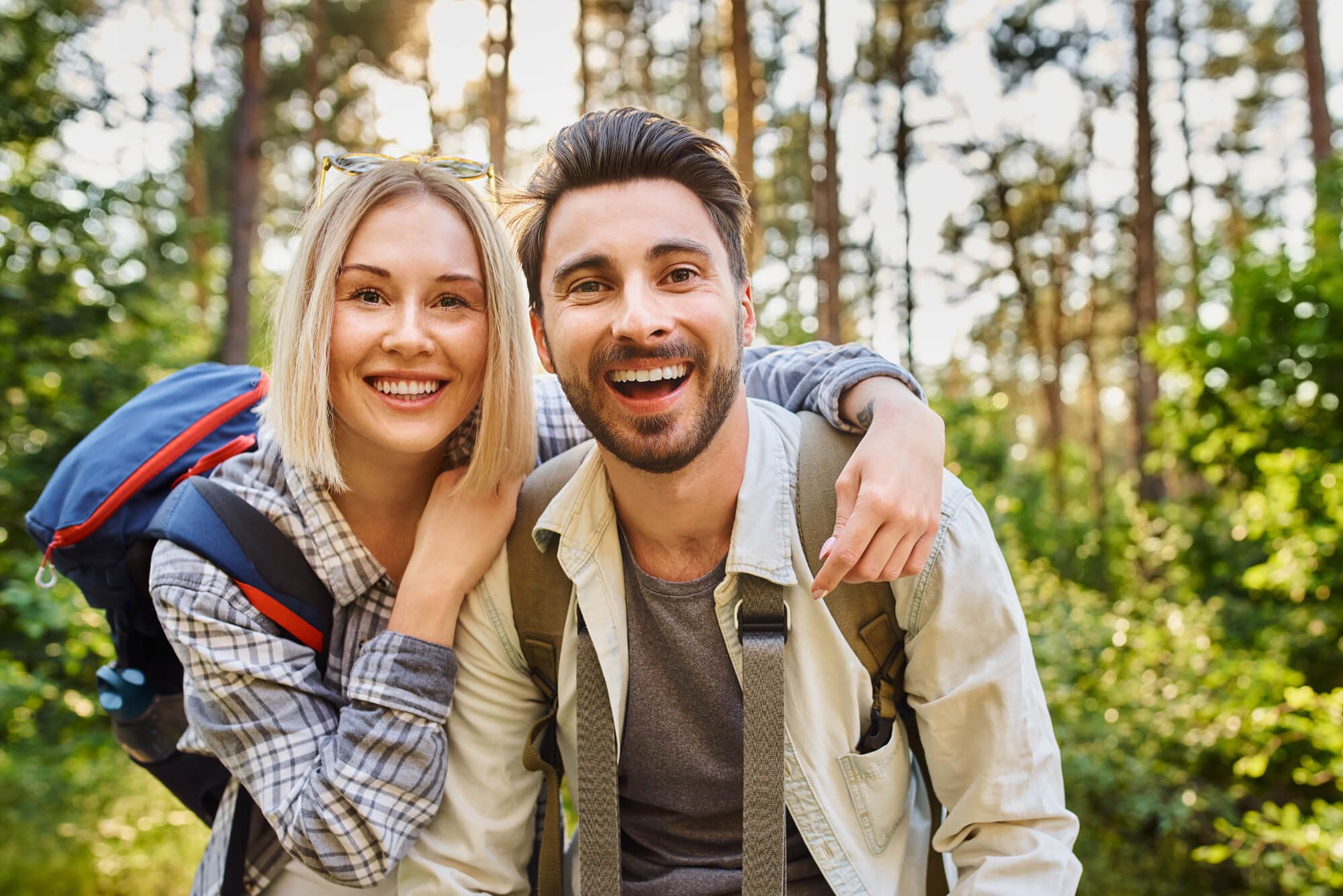 Portrait of a couple smiling in forest