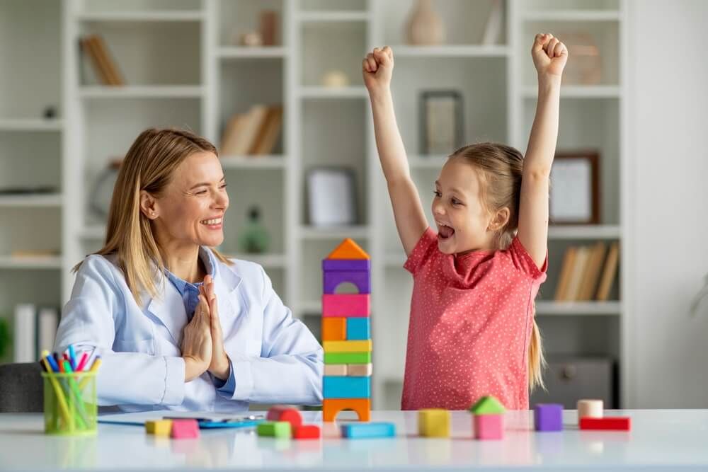 Cute Little Girl And Child Development Specialist