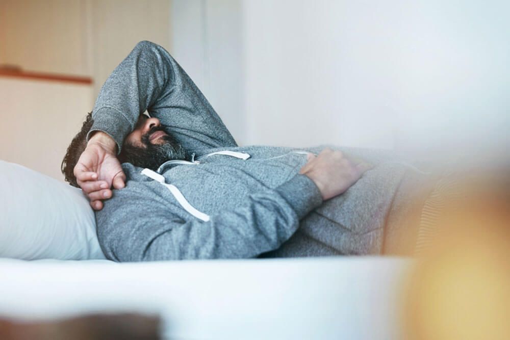 Man in bed with stress