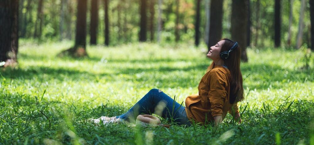 Woman Listening to Music Outside