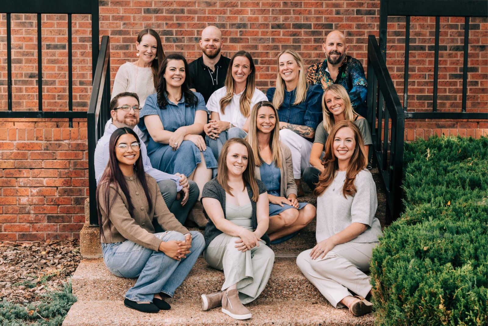 Zephyr Behavioral Health & Wellness group photo of therapists sitting on a staircase in Colorado