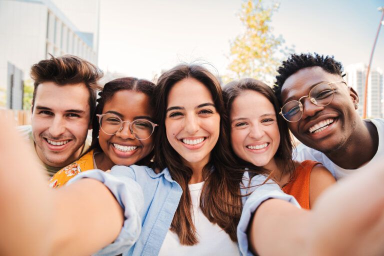 Group of happy teenagers having fun