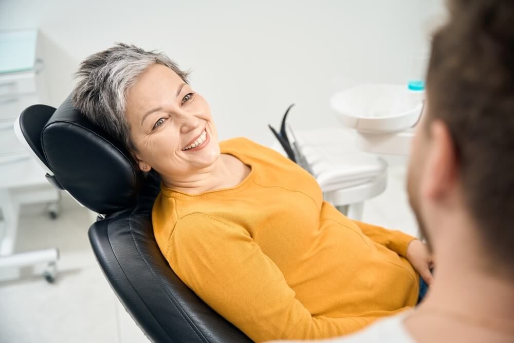 smiling Woman looking at doctor