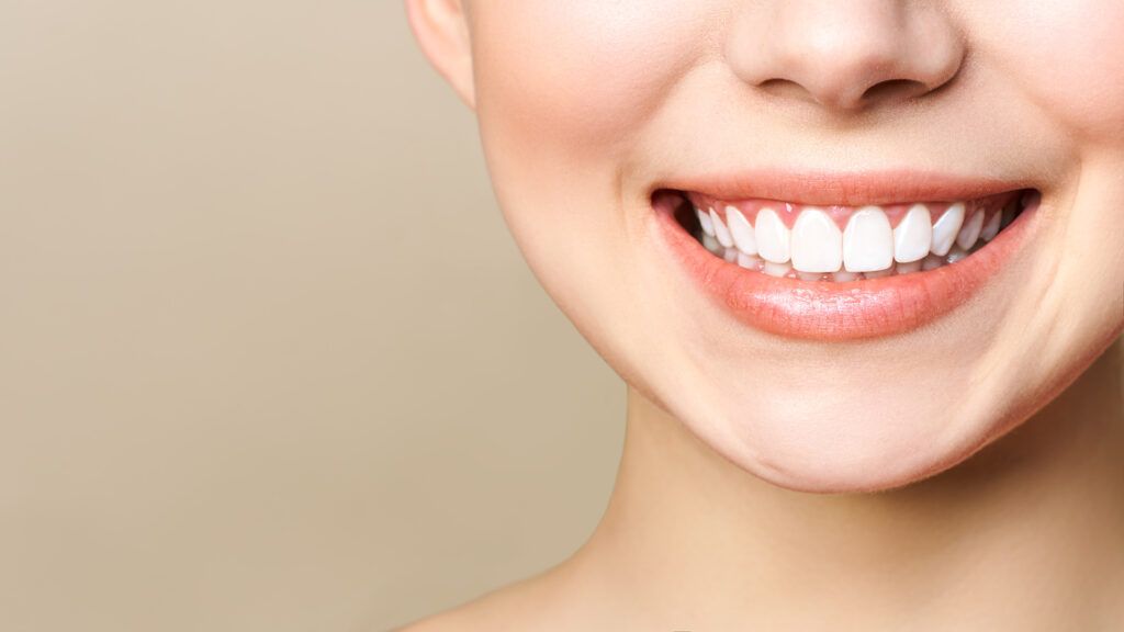 Perfect healthy teeth smile of a young woman