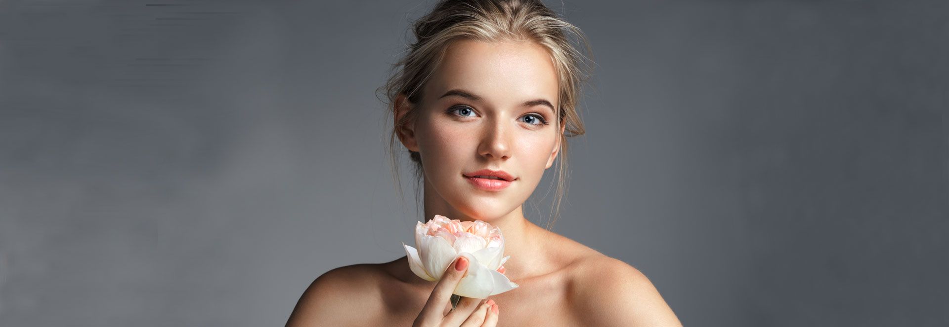 Young beautiful lady with rose