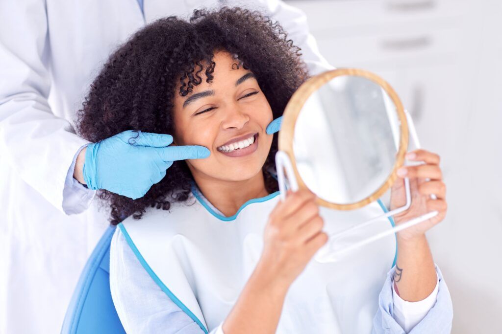 Woman, patient and dentist with mirror for teeth whitening in clinic