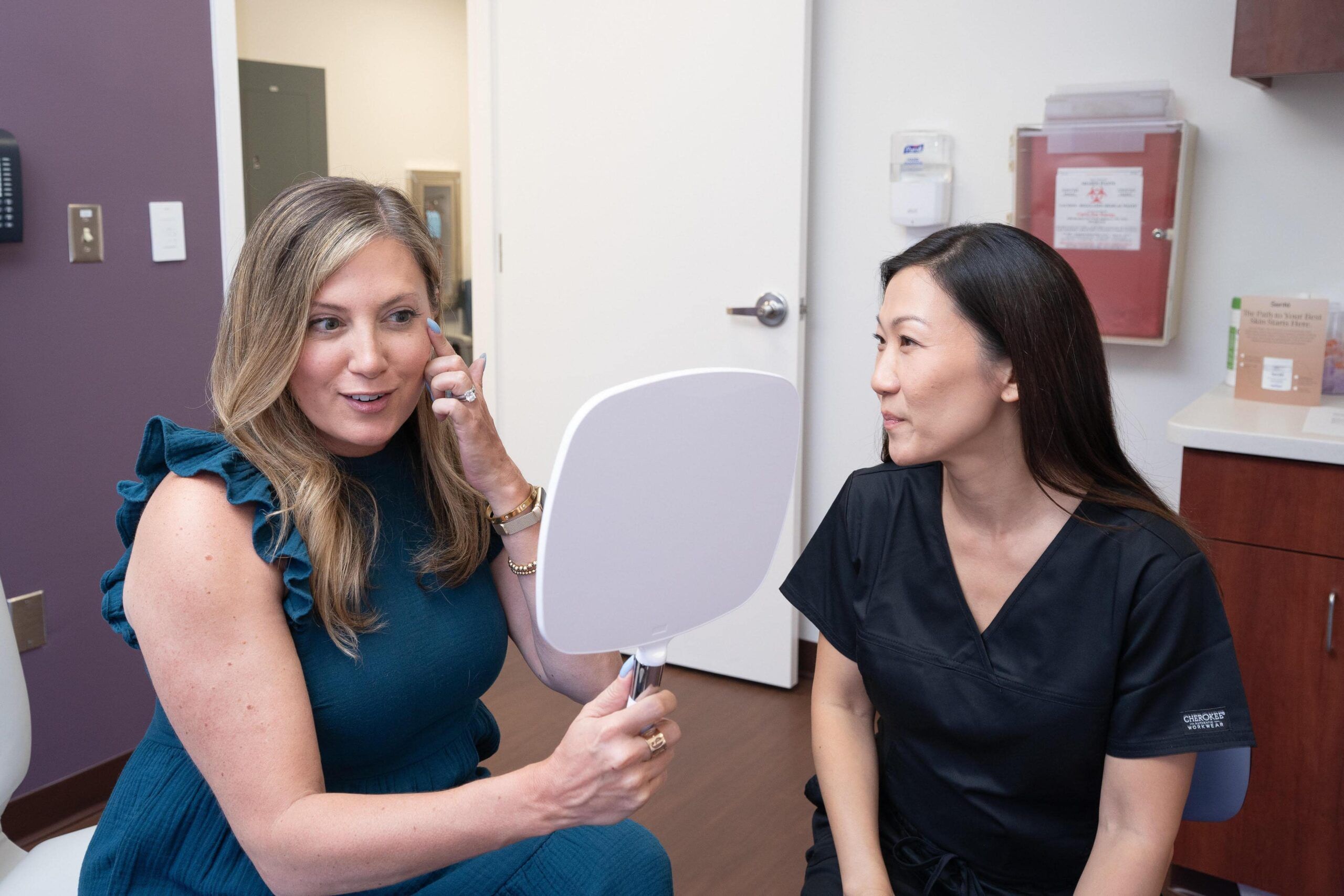 Patient looking at mirror with Esther Kim