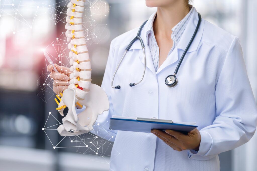 A medical worker shows the spine modal