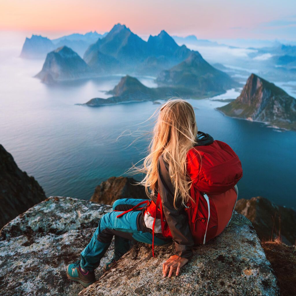 Woman traveler hiking in Norway