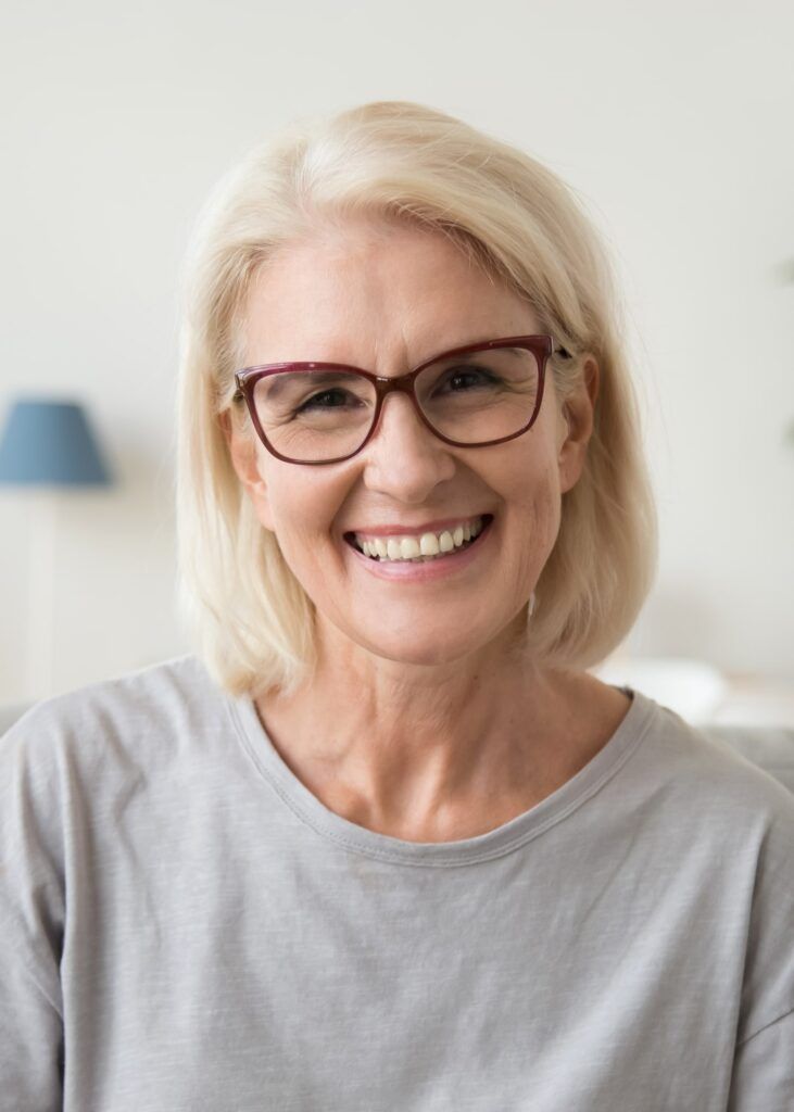 Smiling middle aged mature grey haired woman