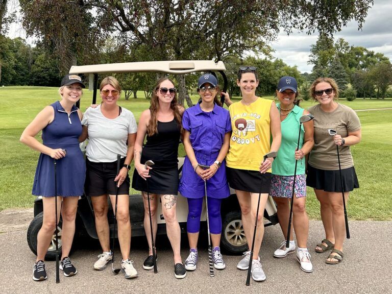 Philp Family Dentistry team member playing golf