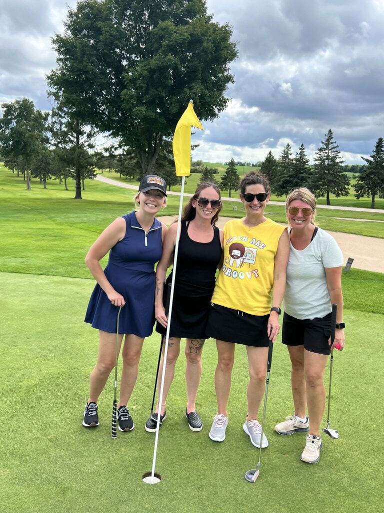 Philp Family Dentistry team member playing golf