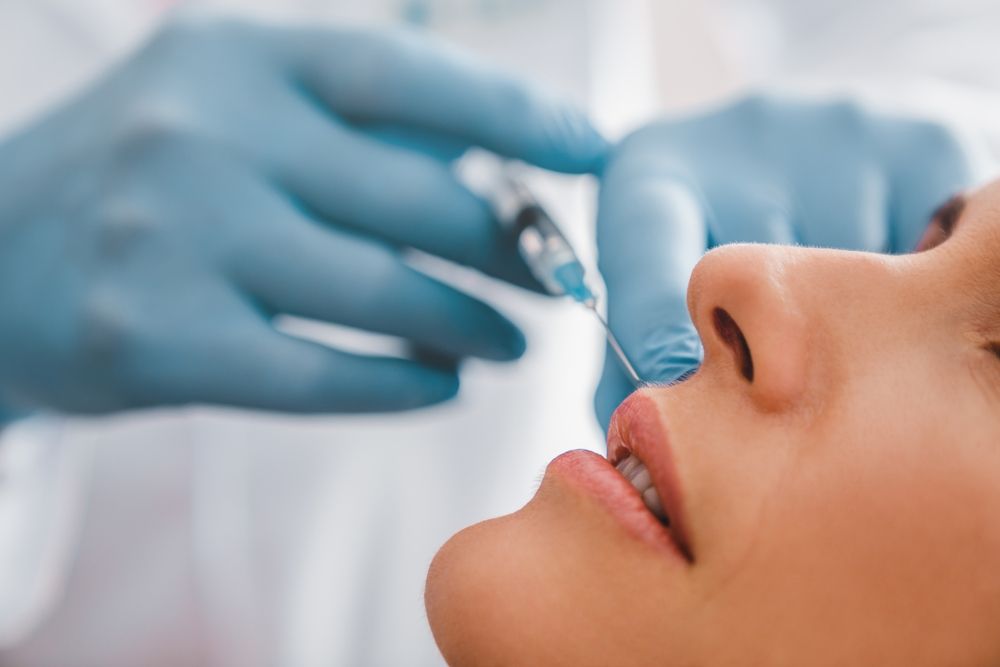 Close,Up,Of,Adult,Woman,Getting,Lip,Injection,In,Beautician