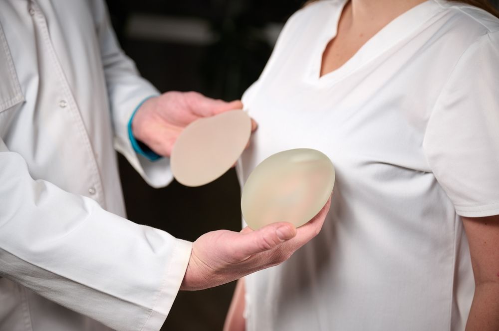Female,Plastic,Surgeon,Demonstrates,Breast,Implants,