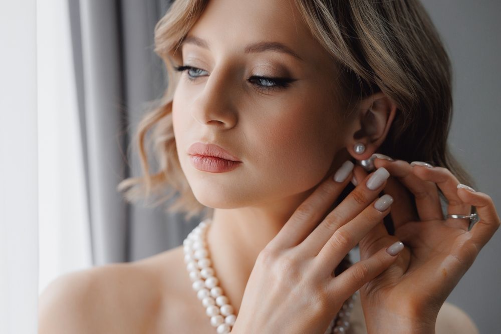 Portrait,Of,Happy,Elegant,Young,Woman,With,White,Earrings,In