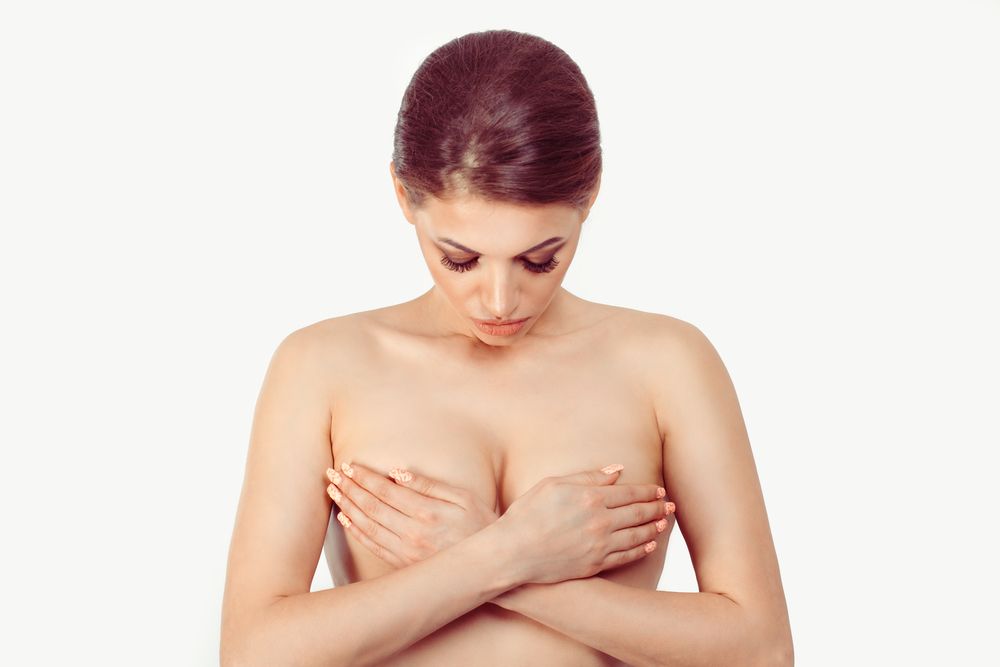Breast,Cancer,Awareness,,Middle,Age,Female,Examining,Her,Breast,For
